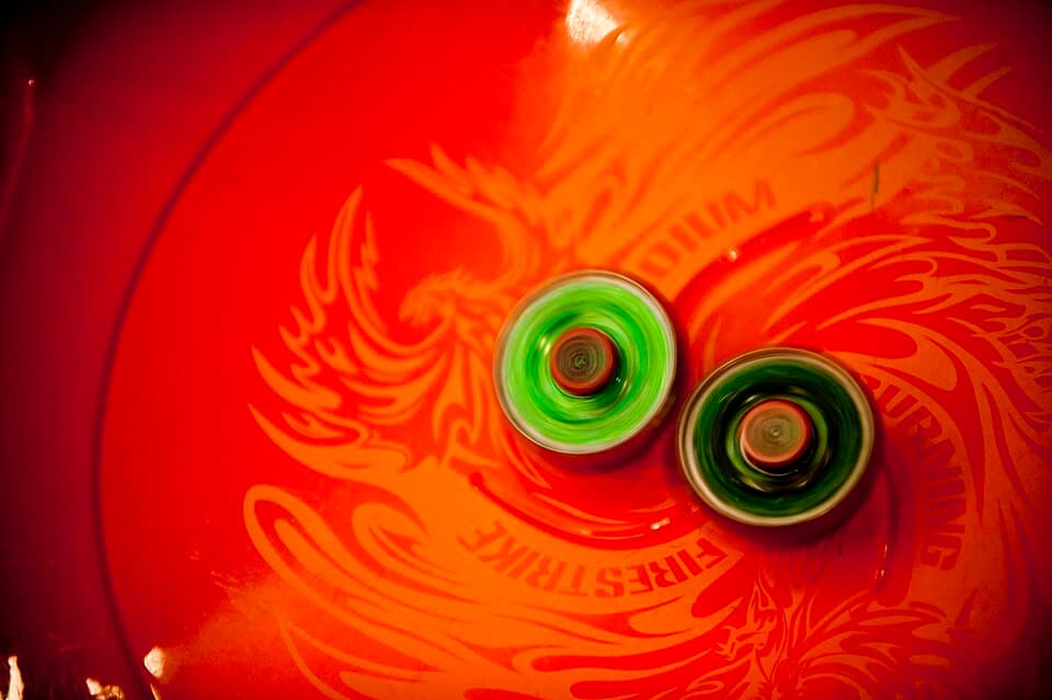 Beyblade spinning tops battling in a Beystadium