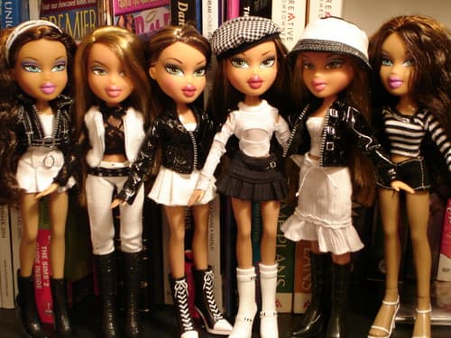 Lineup of Bratz fashion dolls in black and white outfits