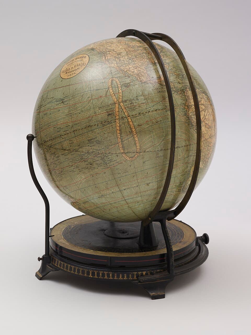 Antique world globe on a metal stand