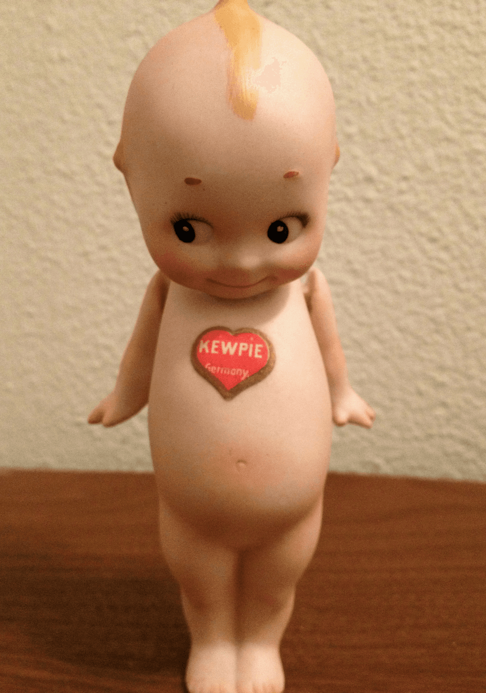 Vintage Kewpie doll with heart sticker