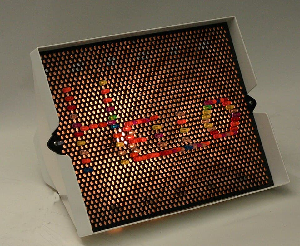 Lite-Brite light board with colorful pegs