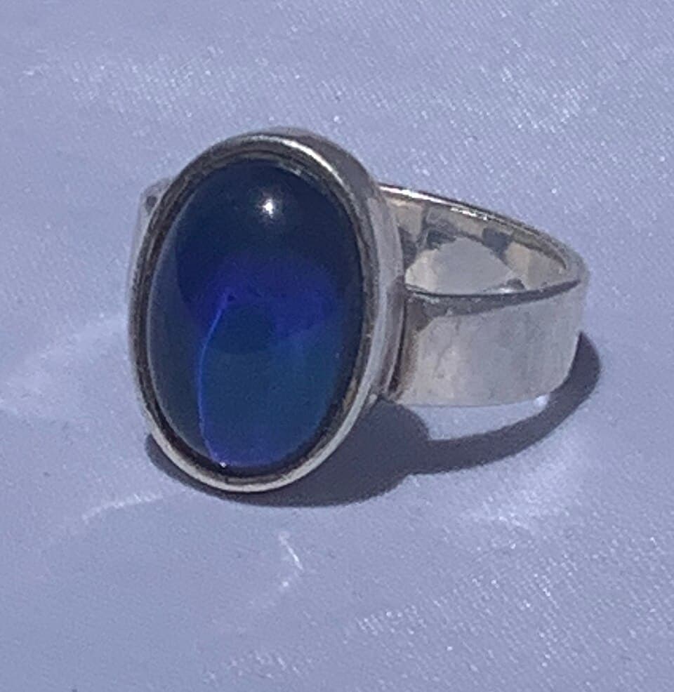 Mood ring with oval stone and silver band