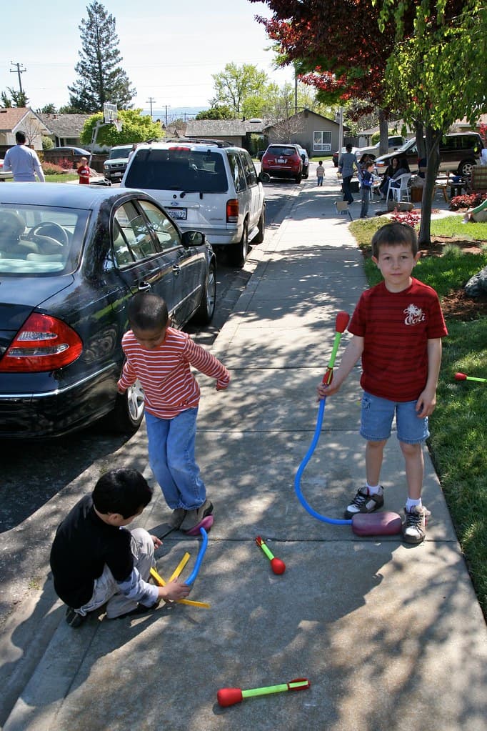 Children playing with a Stomp Rocket launcher set