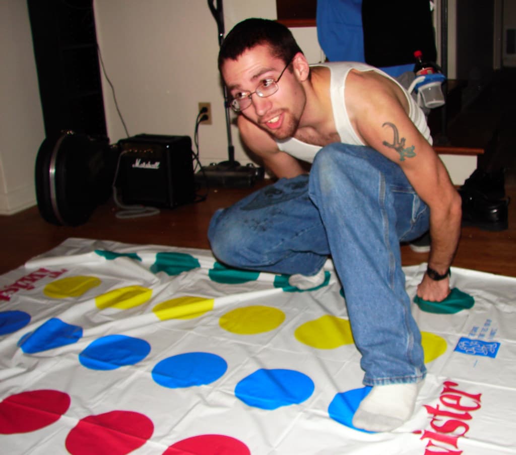 Playing Twister on the classic polka-dot mat