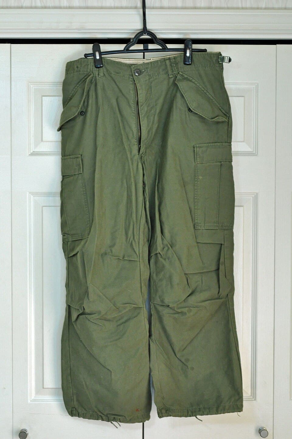 Olive green cargo pants with multiple pockets