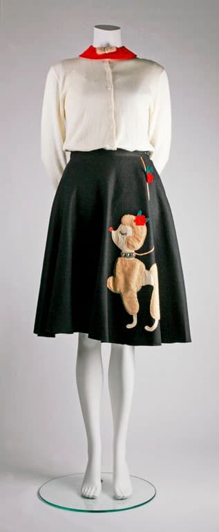 Black felt poodle skirt with cream cardigan on mannequin